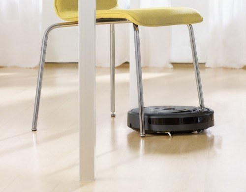 roomba 650 navigates around a chair