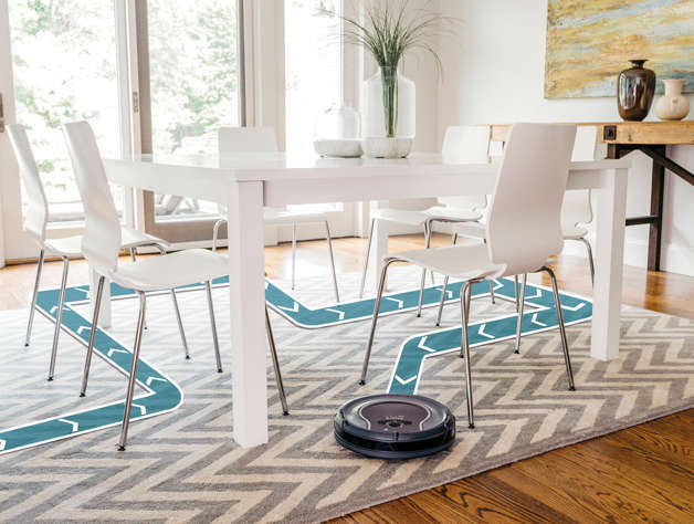 Shark Ion 750 navigating between dining chairs and a dining table.