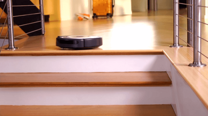 This Roomba's drop sensor prevents it from falling down a flight of stairs.
