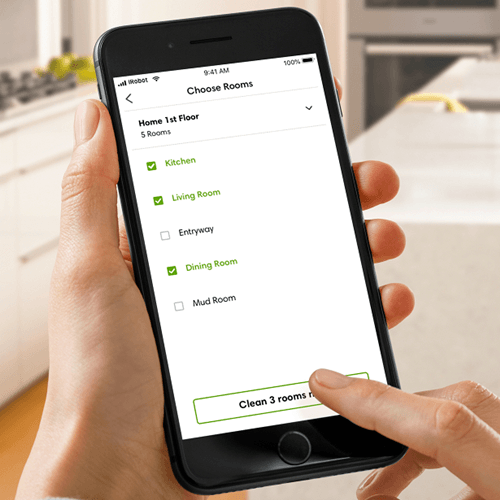 Smartphone showing Roomba's latest feature update on the mobile app, allowing you to name rooms and choose which rooms to clean.